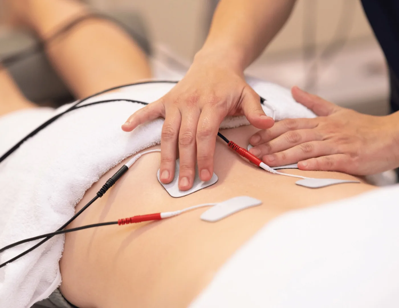 Electric stimulation therapy for shoulder and upper-back pain at Herner Chiropractic in Nashua, NH